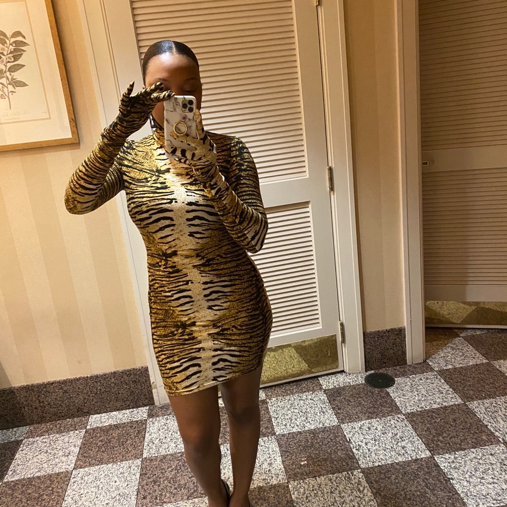 Tiger print dress with matching gloves.